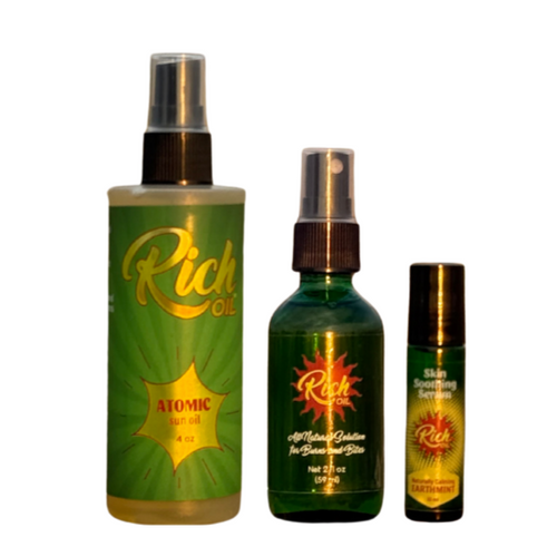 Three bottles of Rich Oil on a white background