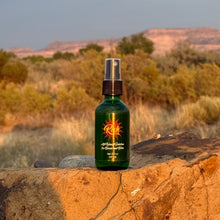Load image into Gallery viewer, Green Rich Oil spray bottle in New Mexico desert
