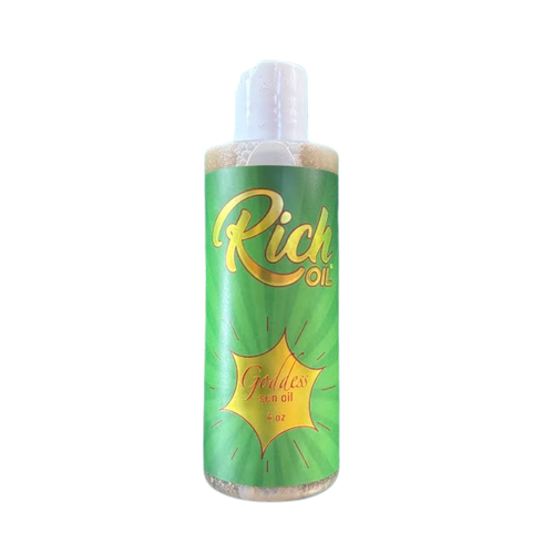 Green bottle of 'Godess Oil' on a white background
